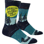 Blue Q Men's Crew socks. A night landscape illustrated with various shades of blue, pine trees with green accents line the horizon with green starts behind them. A large green circle appears as the moon and in it text reads "Dragons and Wizards and Shit"