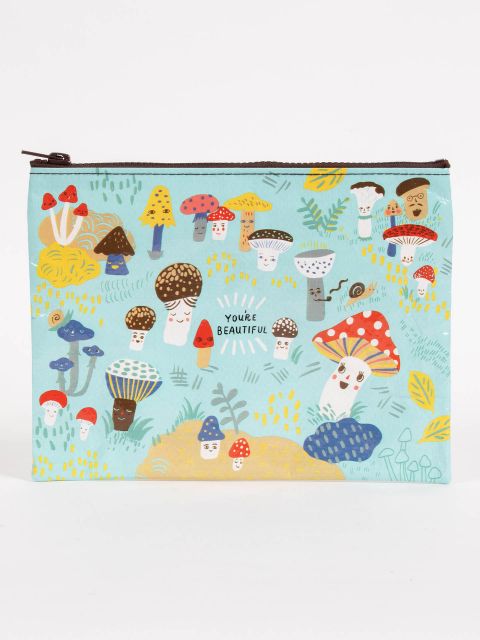 Blue Q pouch made from recycled material. Light blue with multi-colored mushrooms with little faces illustrated all over.  in the middle it reads "You're beautiful"