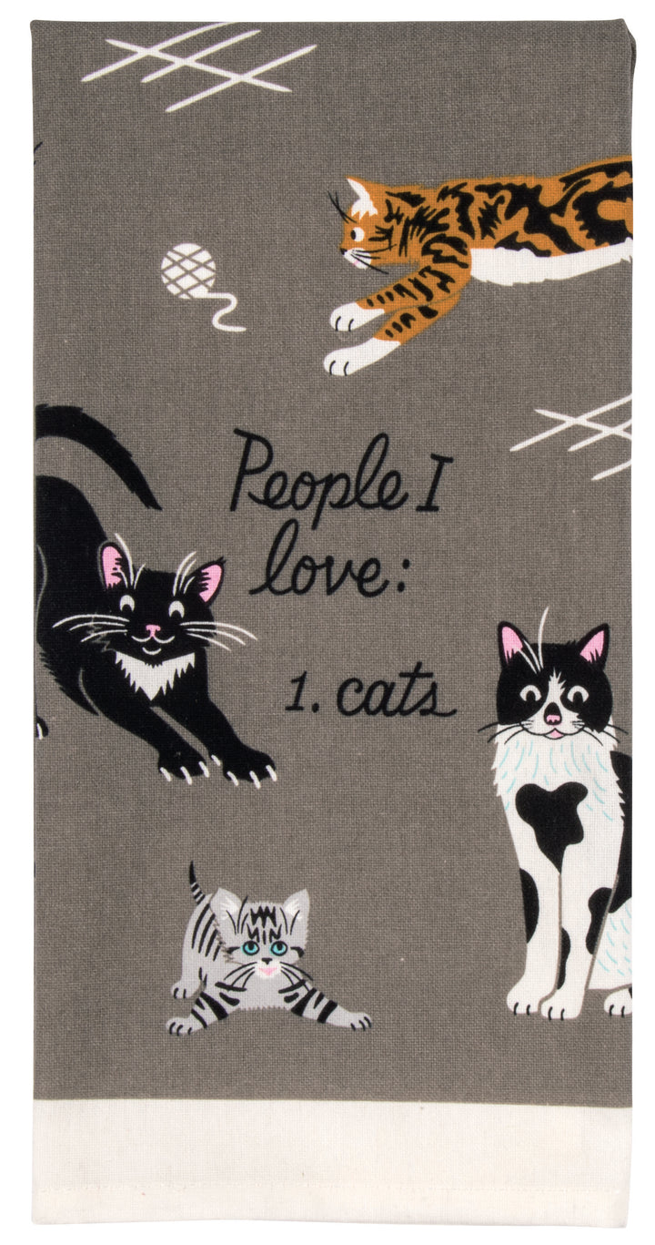 Blue Q dish towel. Grey background with a variety of orange, black and white cats all over. In the middle the words "People I love: Cats"