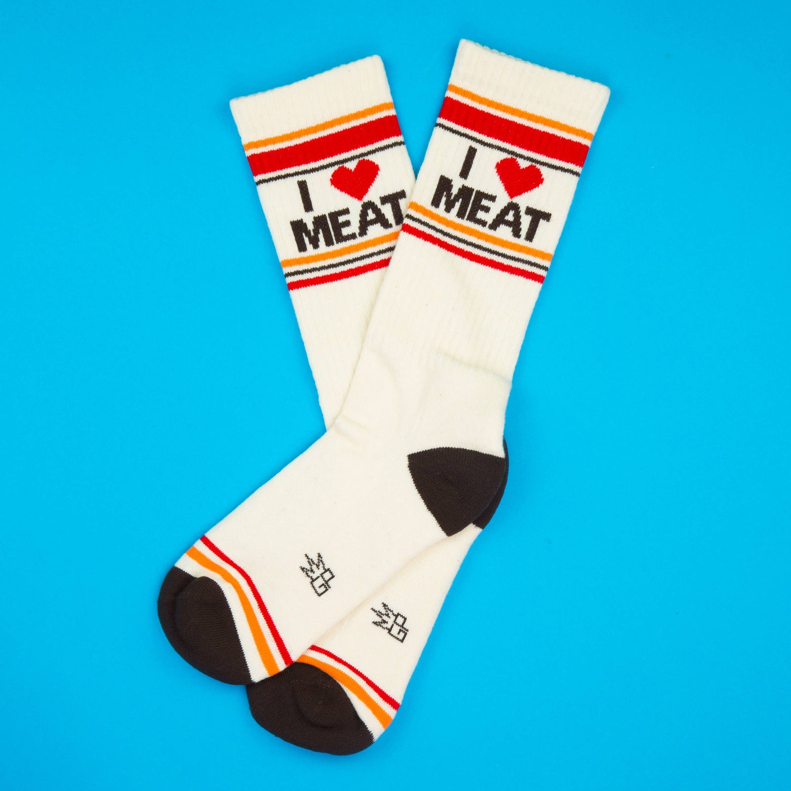 White socks with 'I ❤️ MEAT' text on a blue background