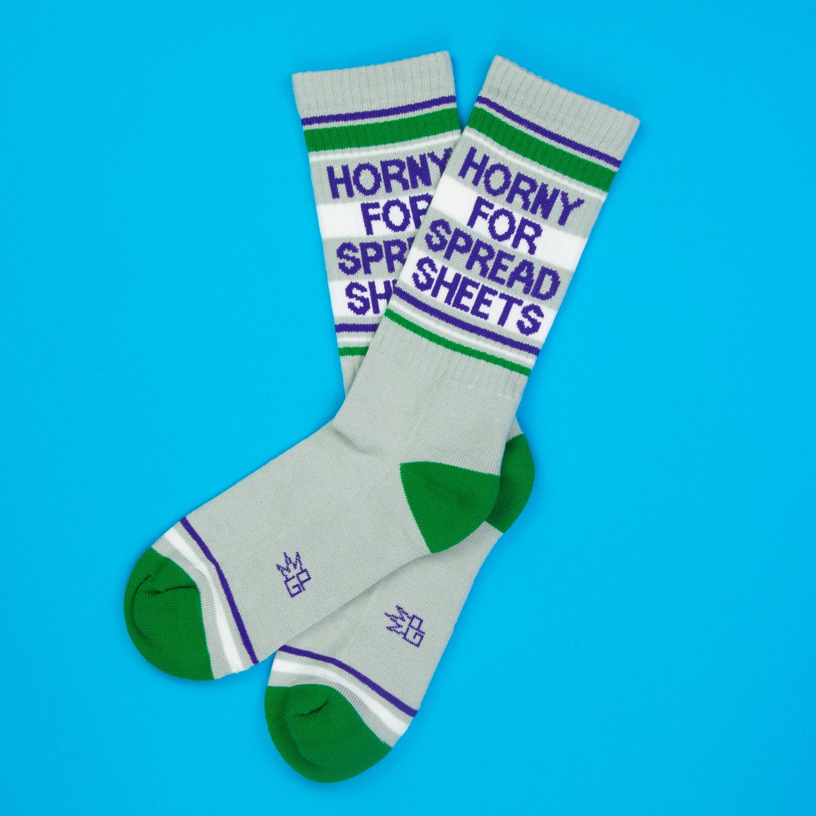 Pair of socks with text ' Horny for spreadsheets' on a blue background