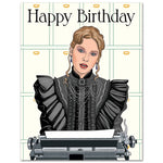 A folded A2 birthday card featuring an illustration of Taylor Swift in a black Victorian-era dress with a typewriter, with the text 'Happy Birthday' on the front.