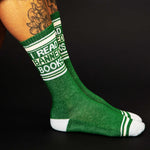 Green sock with text 'I Read Banners Books' on a black background