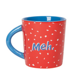 Red mug with blue handle and 'Meh.' text on a white background