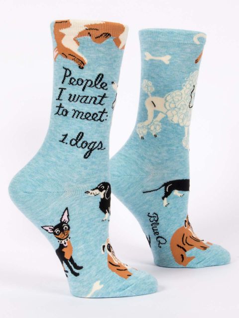 Blue Q crew socks, Light blue with illustrations of different breeds of dogs (a corgis, chihuahua, dauchaund, bull dog, poodle). In black script it reads "People I want to meet: Dogs"