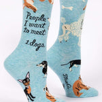 Blue Q crew socks, Light blue with illustrations of different breeds of dogs (a corgis, chihuahua, dauchaund, bull dog, poodle). In black script it reads "People I want to meet: Dogs"