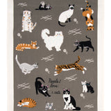 Blue Q dish towel. Grey background with a variety of orange, black and white cats all over. In the middle the words "People I love: Cats"