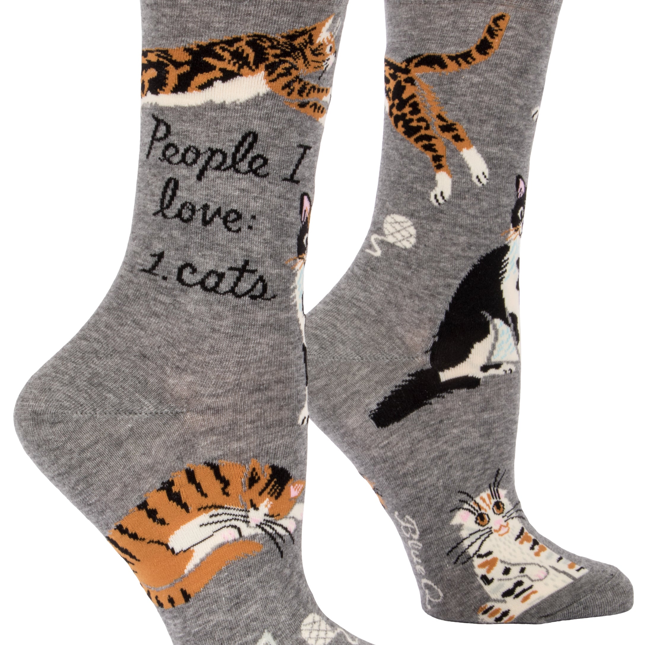 Blue Q crew socks. Grey with multiple orange, black and white cats illustrated on the sock. In the middle in black script reads "People I love: Cats."